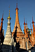 Inle Lake Myanmar. Indein, on the summit of a hill the  Shwe Inn Thein Paya a cluster of hundreds of ancient stupas. Many of them are ruined and overgrown with bushes.